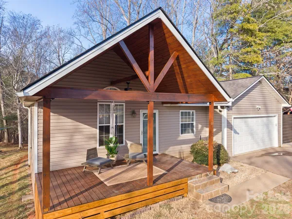 a view of house with backyard