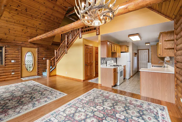 a view of a livingroom with furniture fire place and an entrance