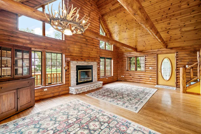 a view of a brick house with a wooden bench
