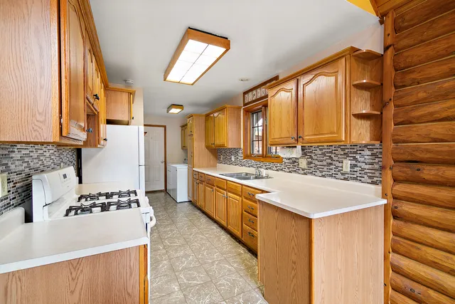 a kitchen with a stove and a refrigerator