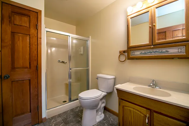 a view of a room with furniture and a window