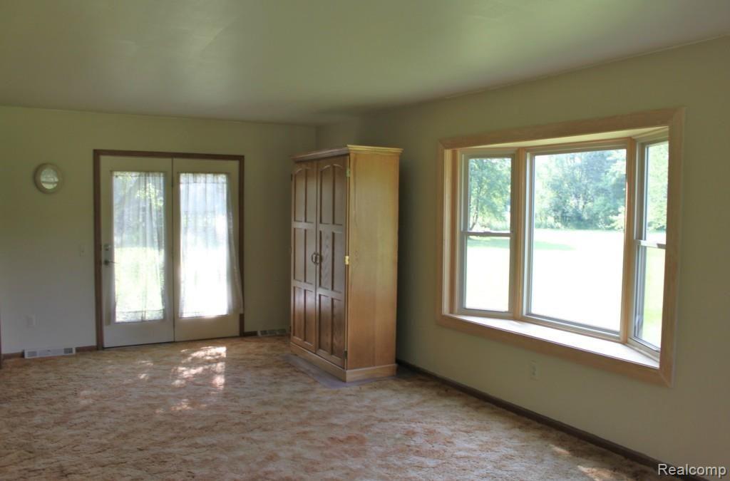 19115 Tipsico Lake Road Fenton, MI 48430 - Photo 6 of 26 Family Room has Door to Rear of Home
