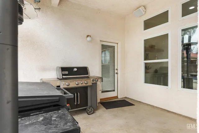 a living room with a piano and a flat screen tv