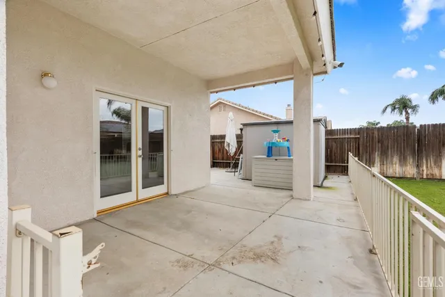 a view of swimming pool with a table and chairs