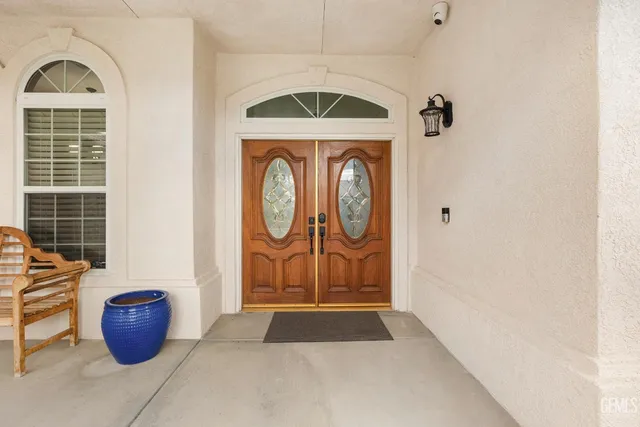 a view of front door with wooden door