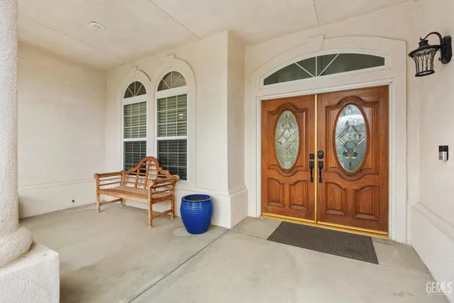 a view of a livingroom with furniture and a large window