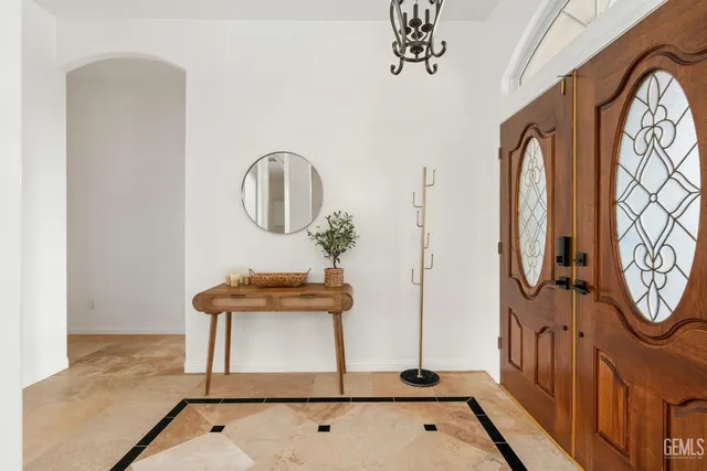 a bathroom with a sink a mirror and a window