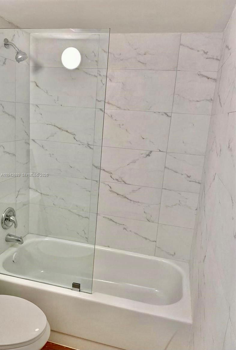 4421 West McNab Road, Unit 20 Pompano Beach, FL 33069 - Photo 11 of 14 a bathroom with a bathtub and a toilet