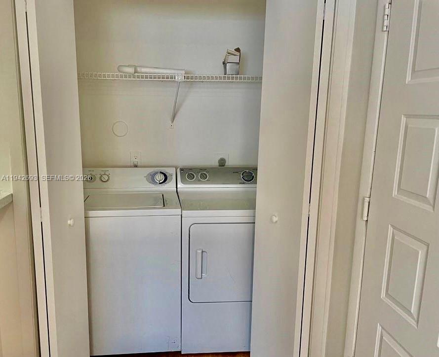 4421 West McNab Road, Unit 20 Pompano Beach, FL 33069 - Photo 12 of 14 a utility room with dryer and washer