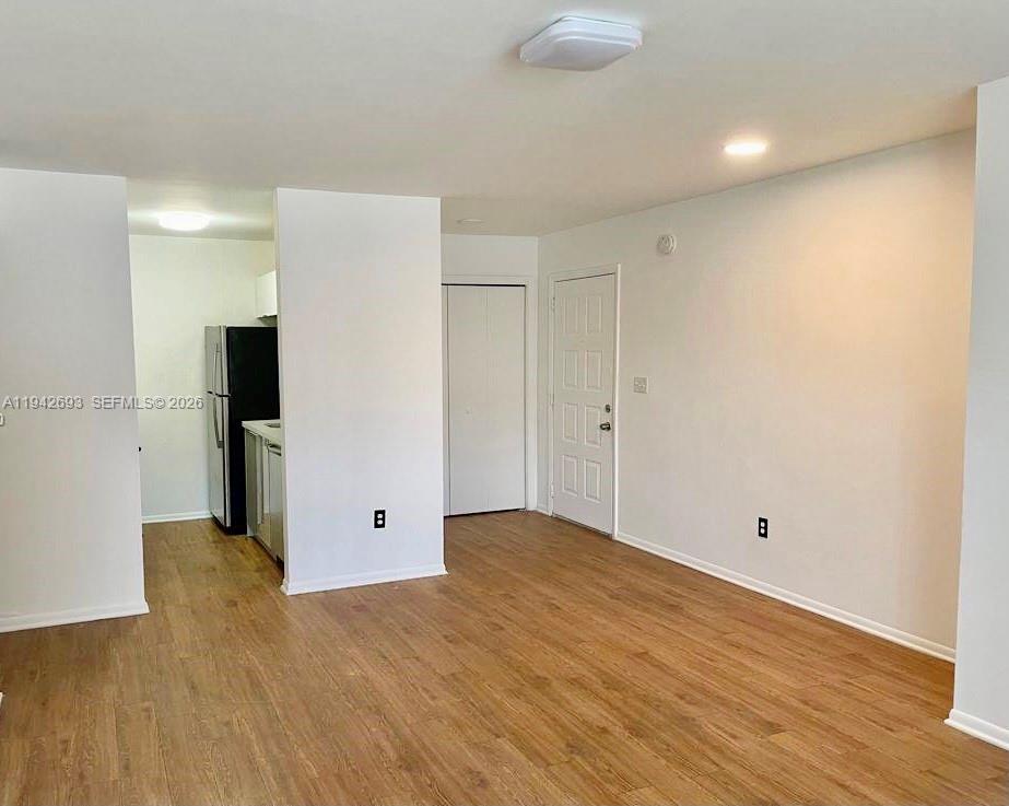 4421 West McNab Road, Unit 20 Pompano Beach, FL 33069 - Photo 2 of 14 a view of empty room with wooden floor