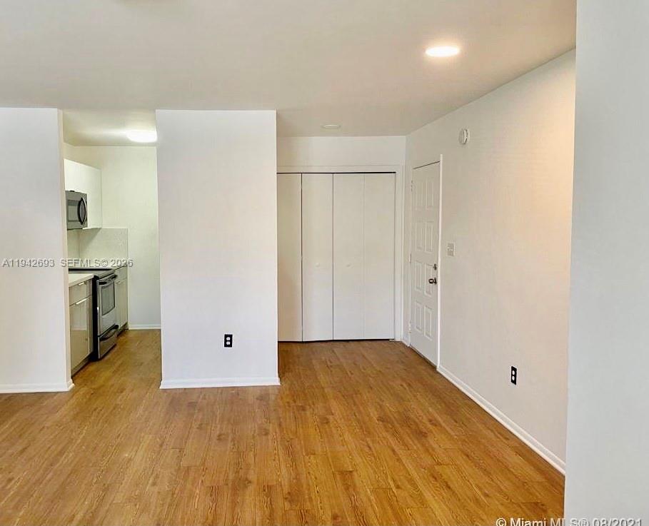 4421 West McNab Road, Unit 20 Pompano Beach, FL 33069 - Photo 3 of 14 a view of empty room with wooden floor