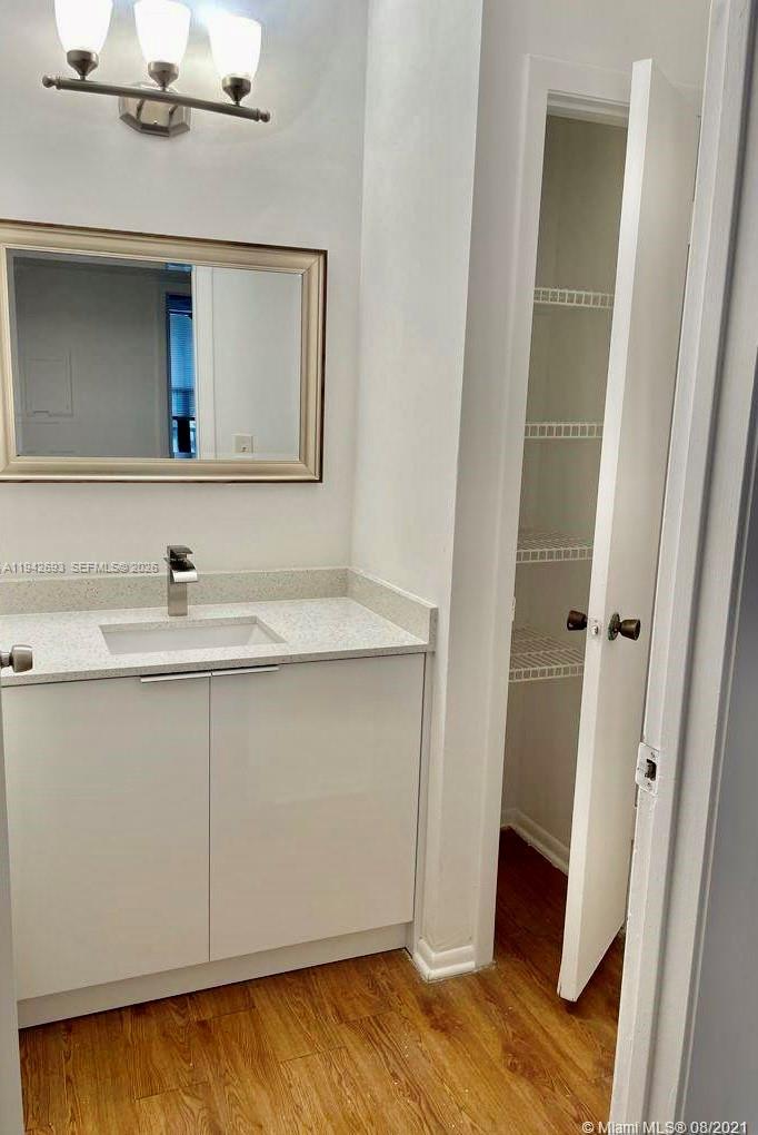 4421 West McNab Road, Unit 20 Pompano Beach, FL 33069 - Photo 10 of 14 a bathroom with a sink and a mirror