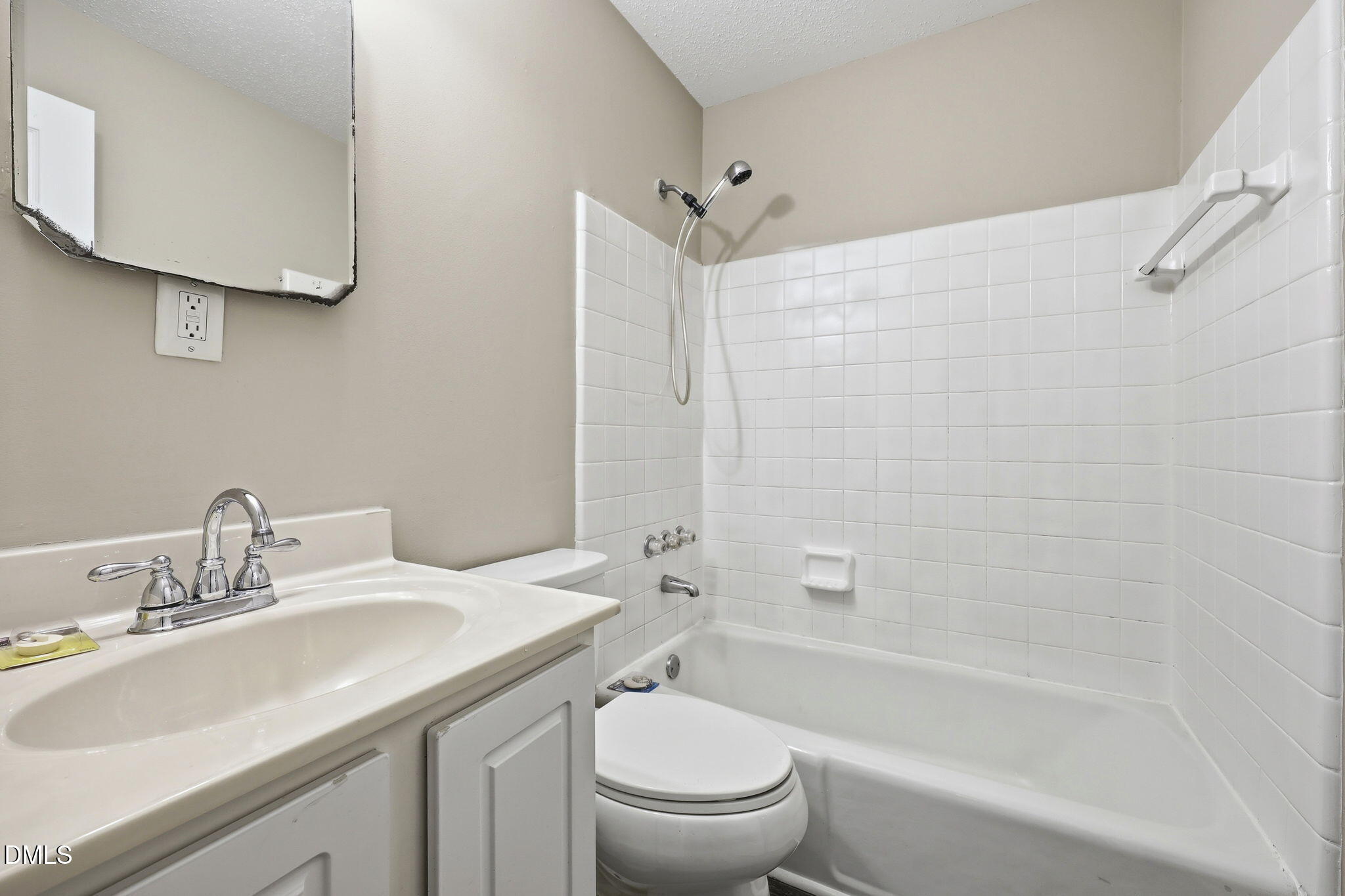 145 Jones Franklin Road, Unit D Raleigh, NC 27606 - Photo 16 of 23 a bathroom with a sink a toilet and shower
