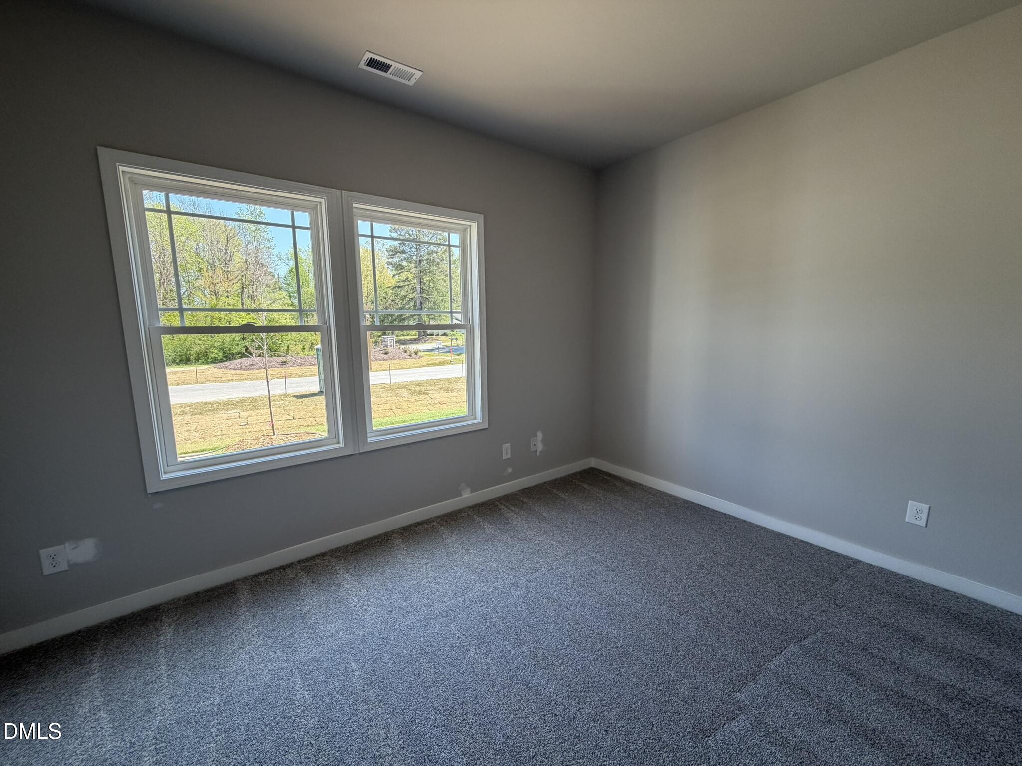 25 Jacobs Ridge Drive Four Oaks, NC 27524 - Photo 13 of 18 an empty room with a window