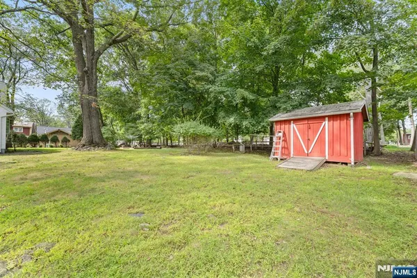 a view of outdoor space with deck and yard