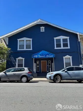 a car parked in front of a house
