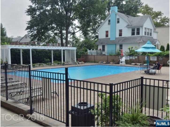 285 Aycrigg Avenue, Unit 22C Passaic, NJ 07055 - Photo 12 of 14 a view of a house with backyard and deck