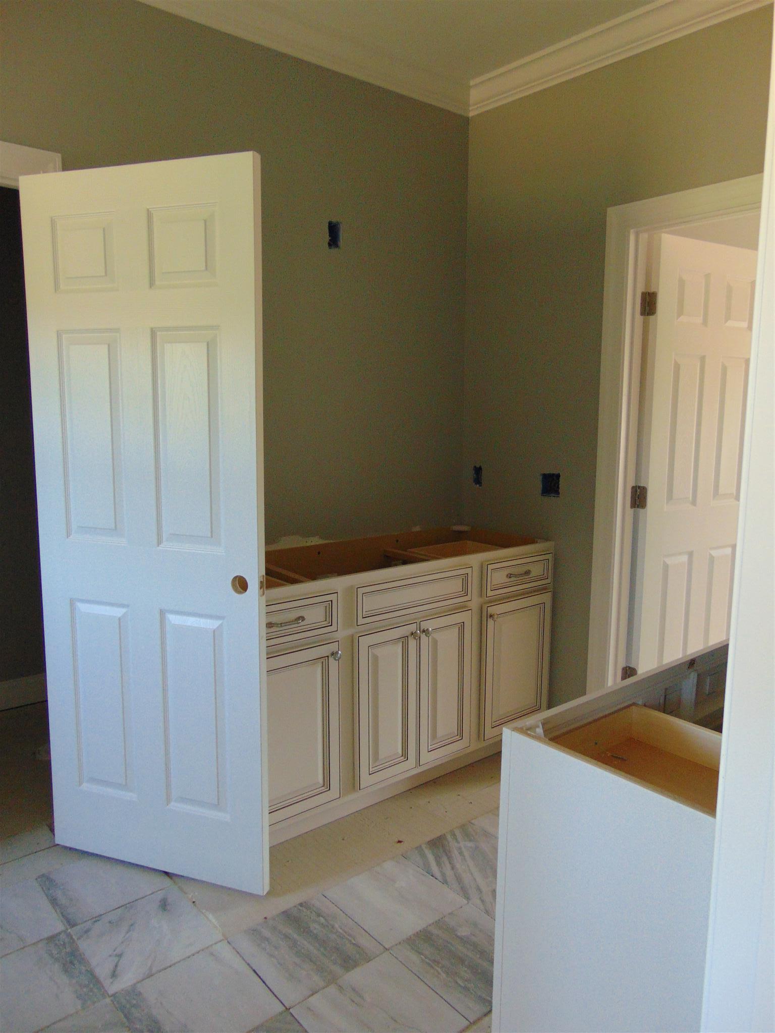 8790 Byrum Chapel Road Portland, TN 37148 - Photo 14 of 19 a kitchen with white cabinets