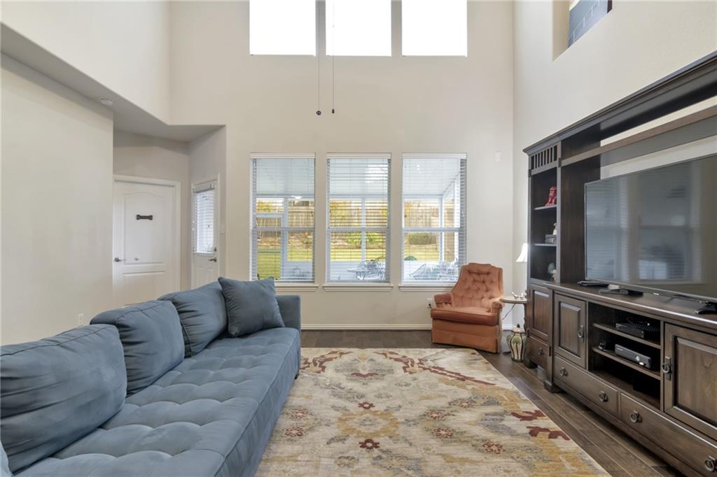 252 Pond View Pass Buda, TX 78610 - Photo 11 of 37 a living room with furniture and a flat screen tv