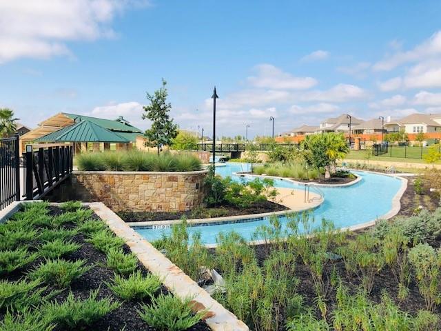 252 Pond View Pass Buda, TX 78610 - Photo 29 of 37 a view of a garden with a lake view