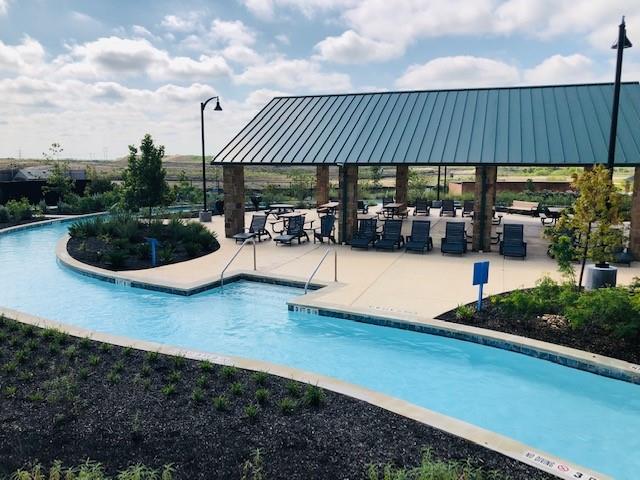 252 Pond View Pass Buda, TX 78610 - Photo 30 of 37 a view of a patio with chairs and potted plants