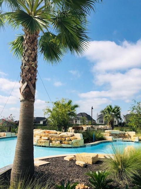 252 Pond View Pass Buda, TX 78610 - Photo 31 of 37 a view of a yard and front view of a house