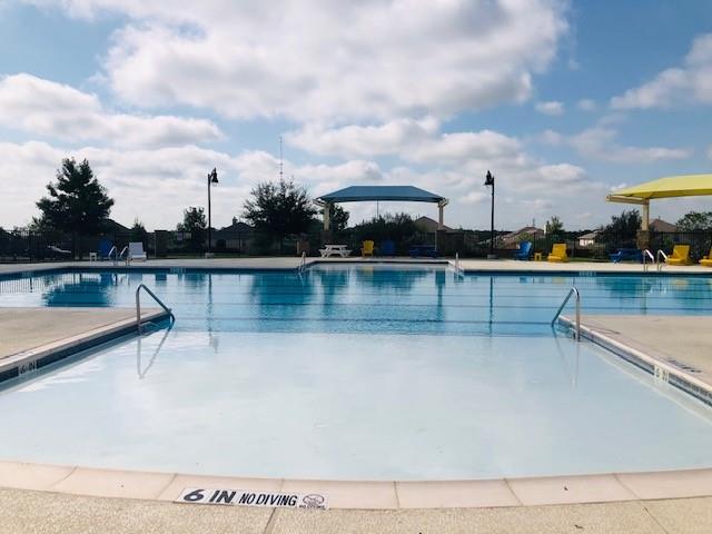 252 Pond View Pass Buda, TX 78610 - Photo 35 of 37 a view of a swimming pool with a lake view