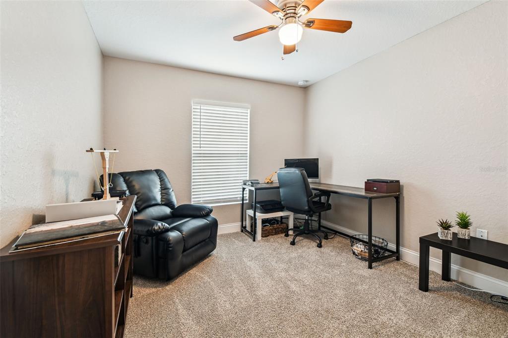 524 Carroll Avenue Lakeland, FL 33815 - Photo 21 of 33 a view of a workspace with furniture and a window