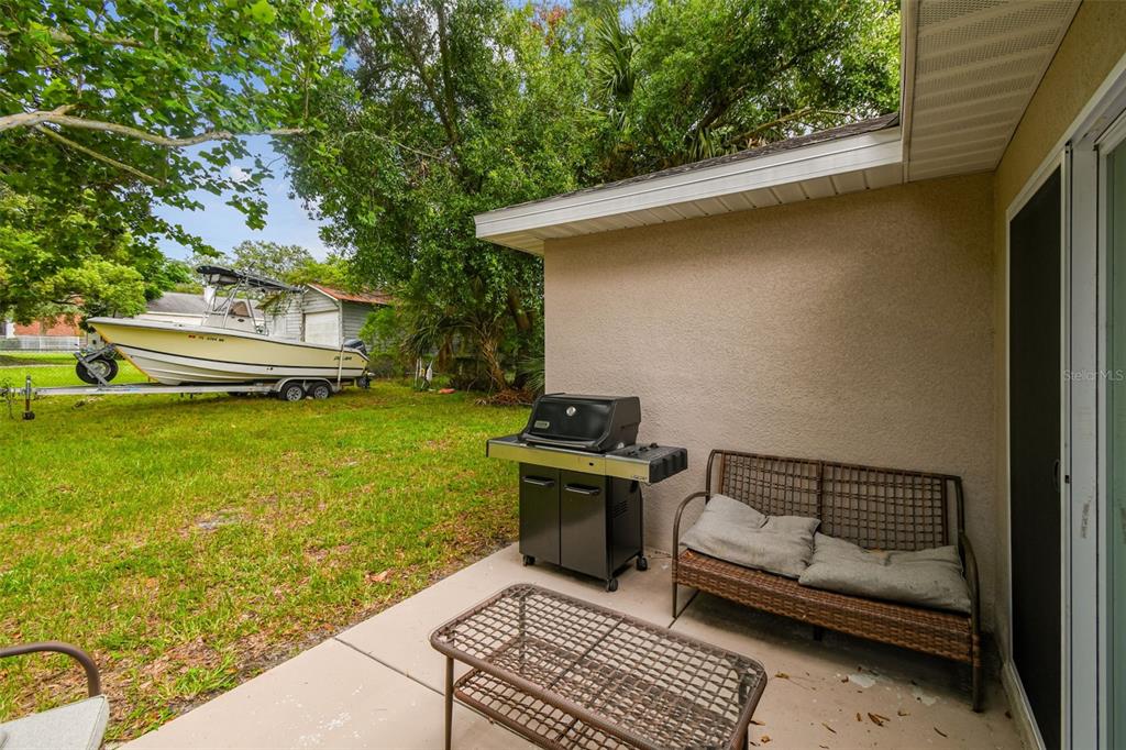 524 Carroll Avenue Lakeland, FL 33815 - Photo 28 of 33 a view of a backyard with sitting area