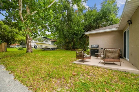 a view of a two chairs in a patio