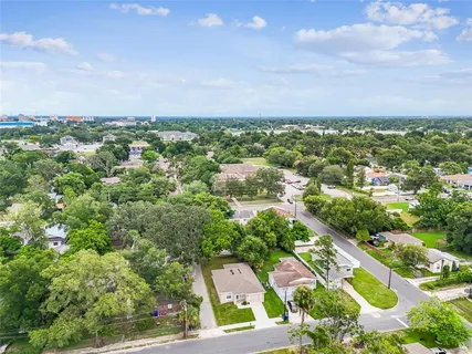 an aerial view of residential building with green space