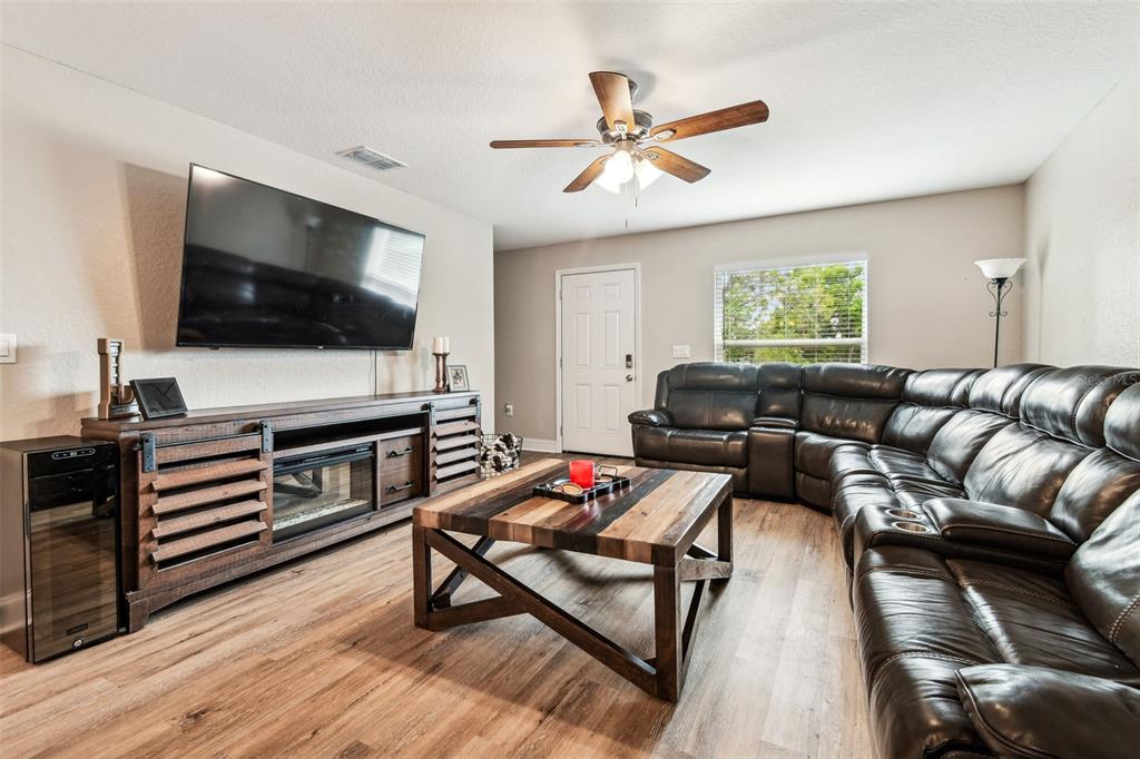 524 Carroll Avenue Lakeland, FL 33815 - Photo 7 of 33 a living room with furniture and a flat screen tv