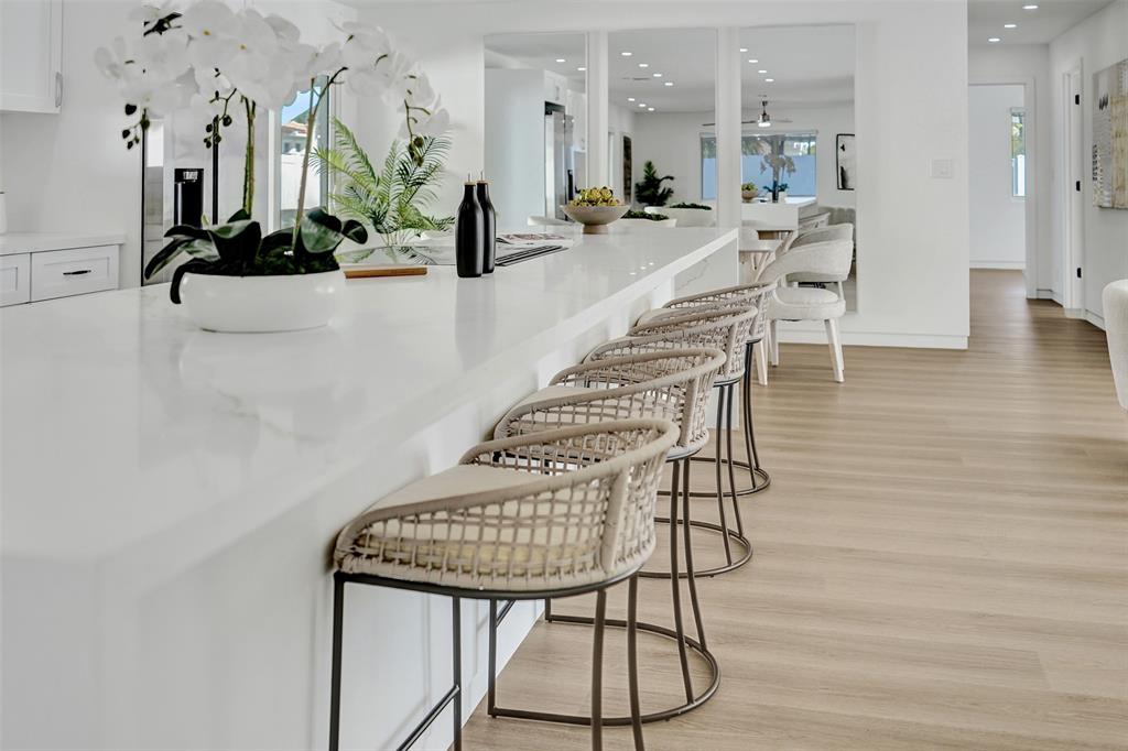 699 Northeast 70th Street Boca Raton, FL 33487 - Photo 20 of 66 a view of a kitchen with furniture and wooden floor