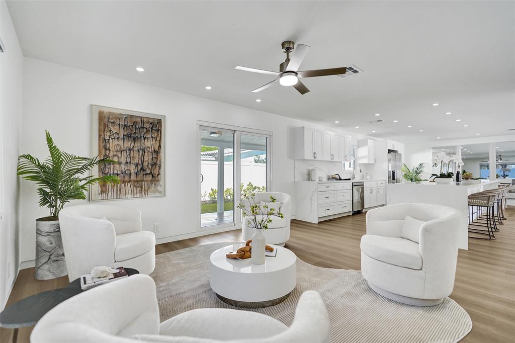 699 Northeast 70th Street Boca Raton, FL 33487 - Photo 29 of 66 a living room with furniture and a large window