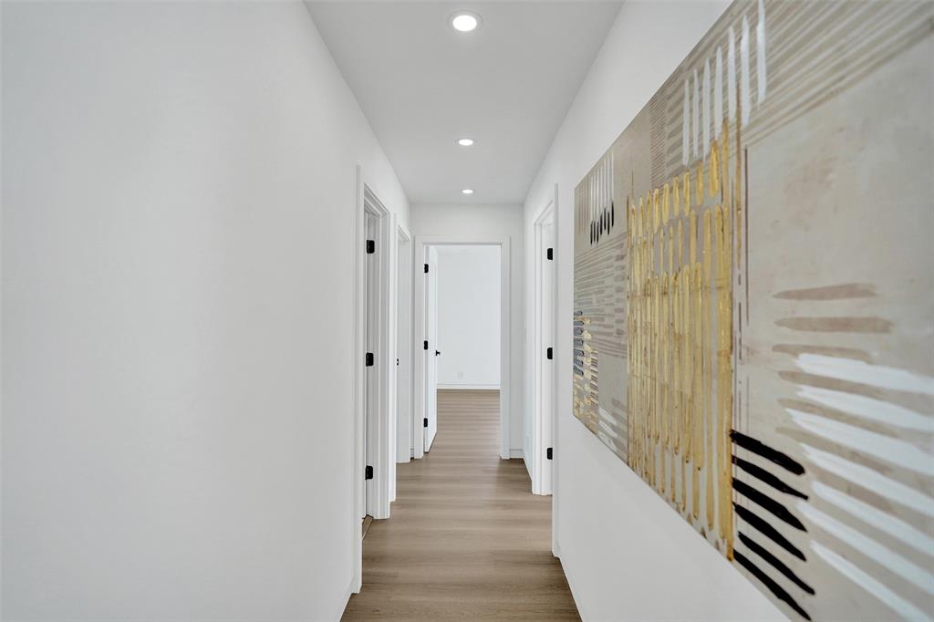 699 Northeast 70th Street Boca Raton, FL 33487 - Photo 30 of 66 a view of a hallway with wooden floor and staircase