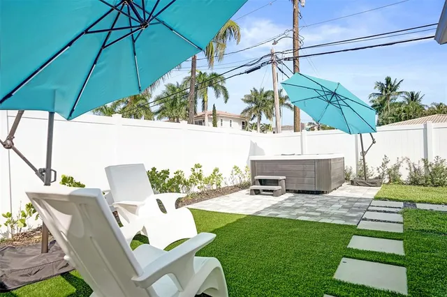 a view of a backyard with a garden and plants