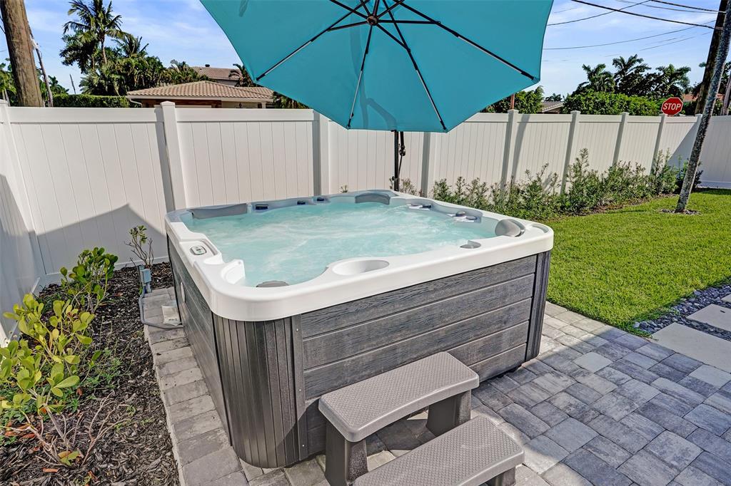 699 Northeast 70th Street Boca Raton, FL 33487 - Photo 52 of 66 a view of a backyard with sitting area