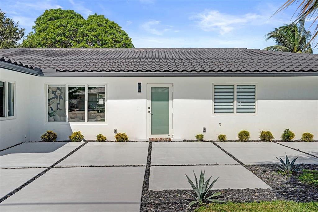 699 Northeast 70th Street Boca Raton, FL 33487 - Photo 59 of 66 a view of a house with a outdoor space