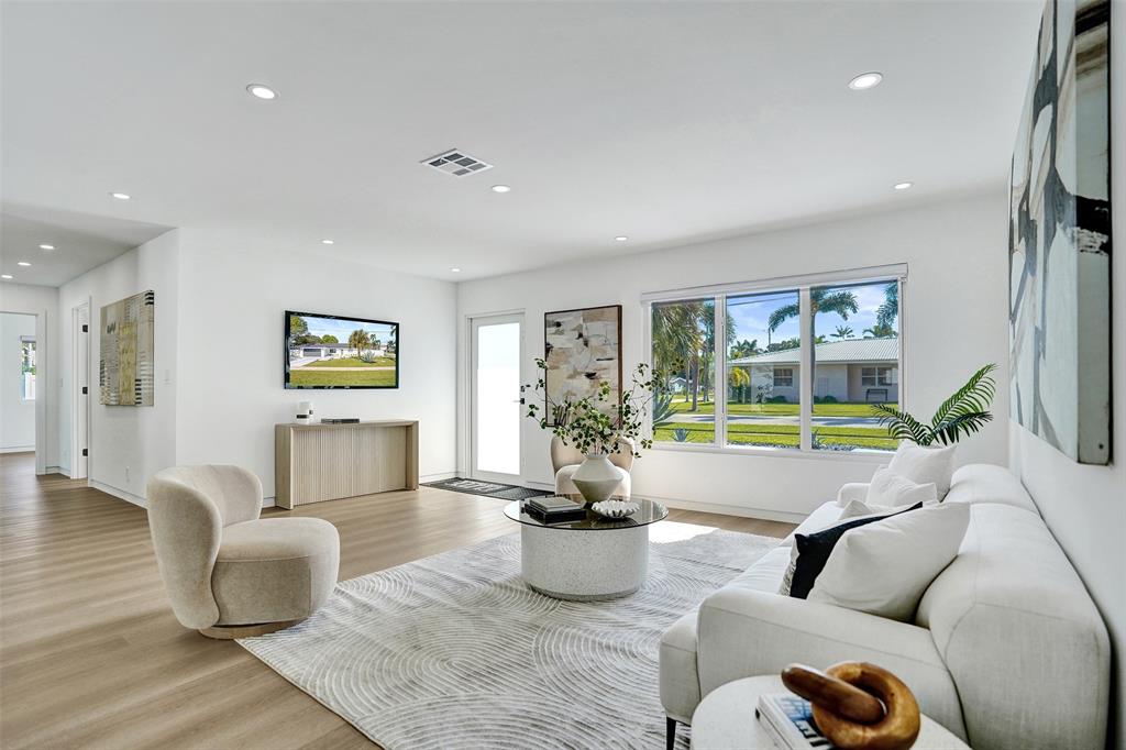 699 Northeast 70th Street Boca Raton, FL 33487 - Photo 7 of 66 a living room with furniture and a large window