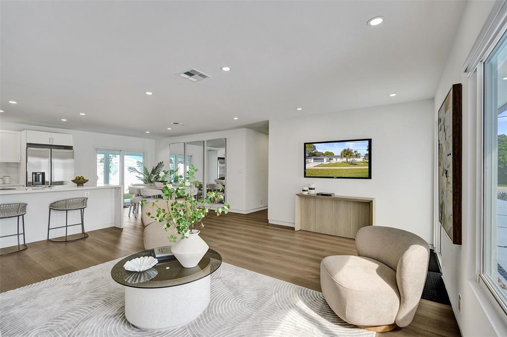 699 Northeast 70th Street Boca Raton, FL 33487 - Photo 8 of 66 a living room with furniture and a potted plant