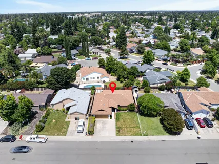 an aerial view of residential houses with outdoor space