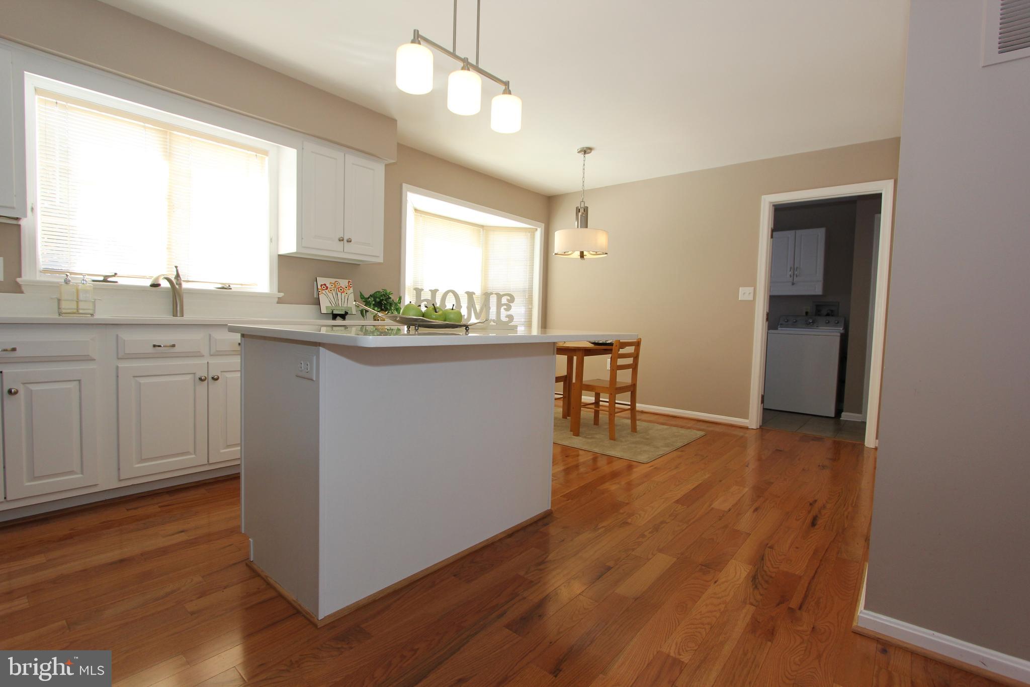 8100 Laurel Ridge Road Frederick, MD 21702 - Photo 11 of 53 Newer cabinets and gleaming hardwood floors