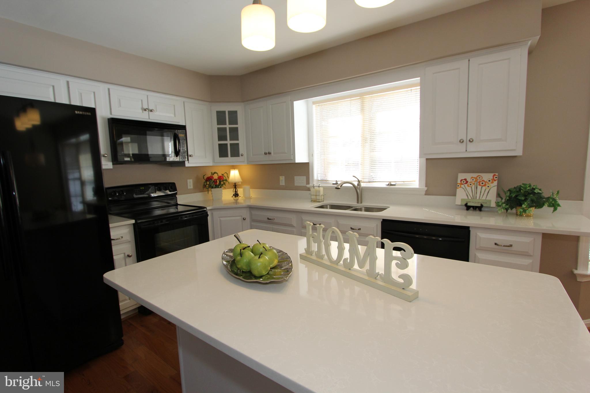 8100 Laurel Ridge Road Frederick, MD 21702 - Photo 12 of 53 Center island, breakfast bar and upgraded lighting