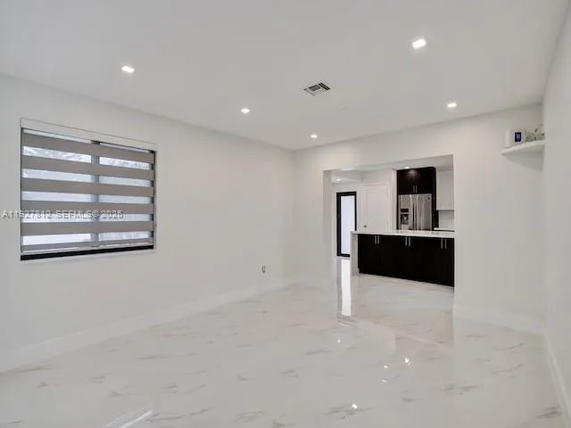 a view of kitchen and front door