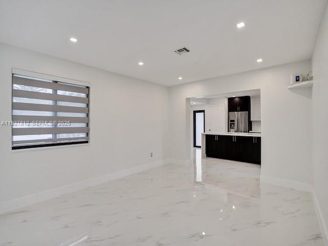 7881 Hope Street Hollywood, FL 33024 - Photo 20 of 39 a view of kitchen and front door