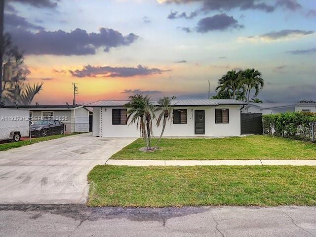 7881 Hope Street Hollywood, FL 33024 - Photo 2 of 39 front view of a house with a yard