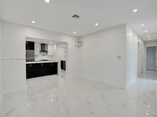 a large bathroom with a sink and a mirror