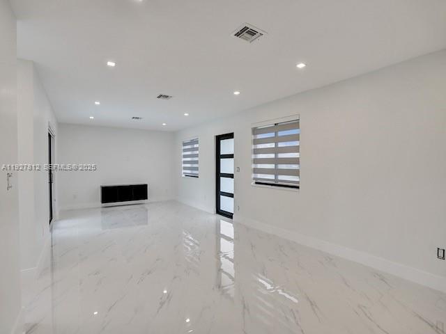 7881 Hope Street Hollywood, FL 33024 - Photo 22 of 39 a view of an empty room with a kitchen