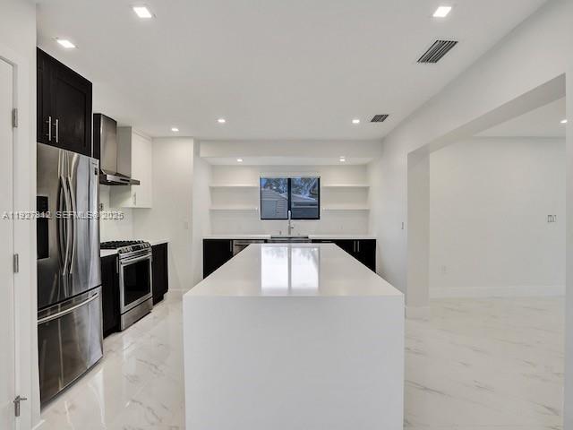 7881 Hope Street Hollywood, FL 33024 - Photo 27 of 39 a kitchen with stainless steel appliances a refrigerator and a stove top oven