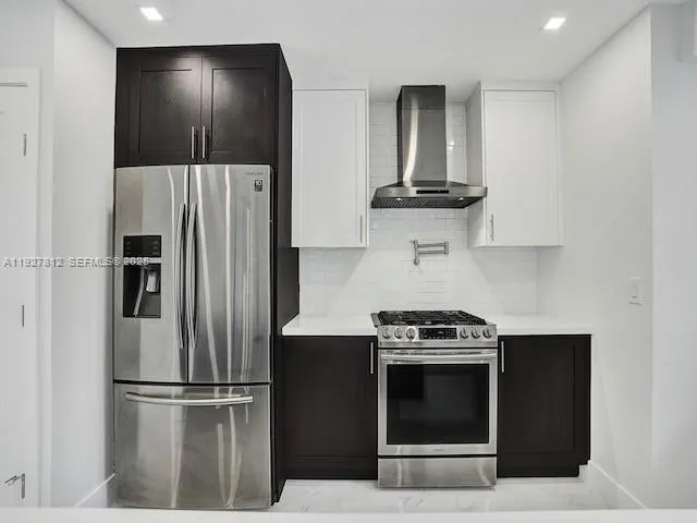 a kitchen with a stove and a refrigerator